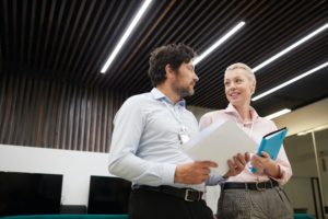 Business couple talking to each other